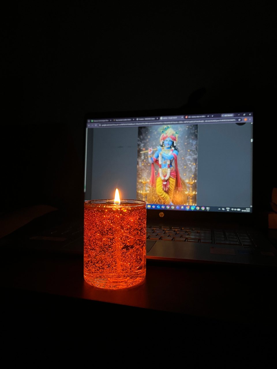 A customer's Pairsense Honey gel candle, lit on a wooden table, held outdoors and glowing